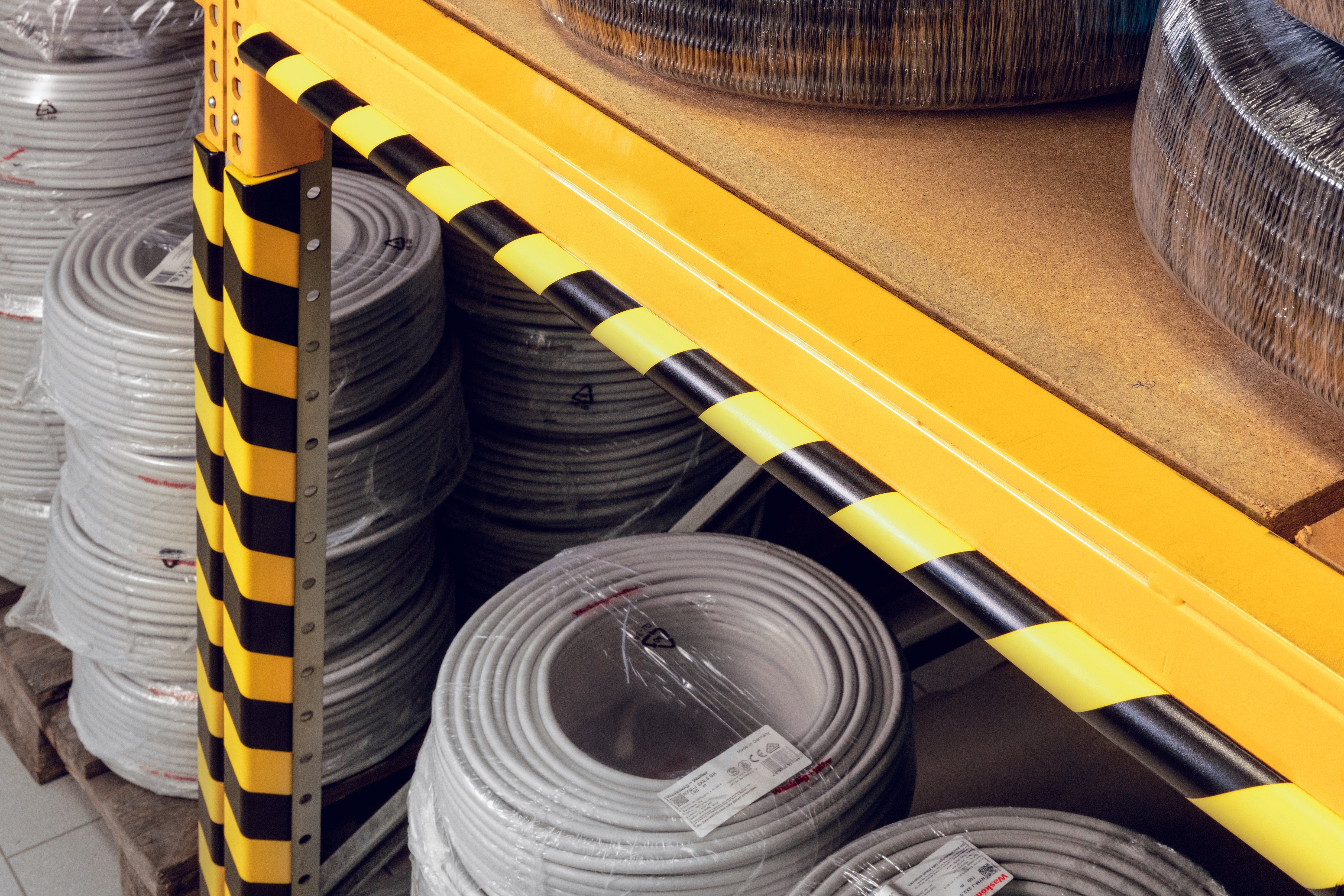 Protection profiles on warehouse shelves
