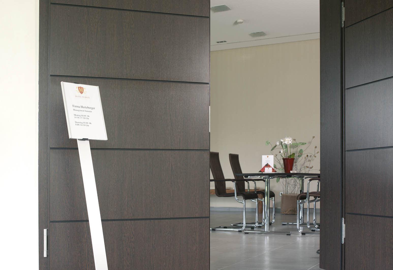 Floor stand being used outside a conference room