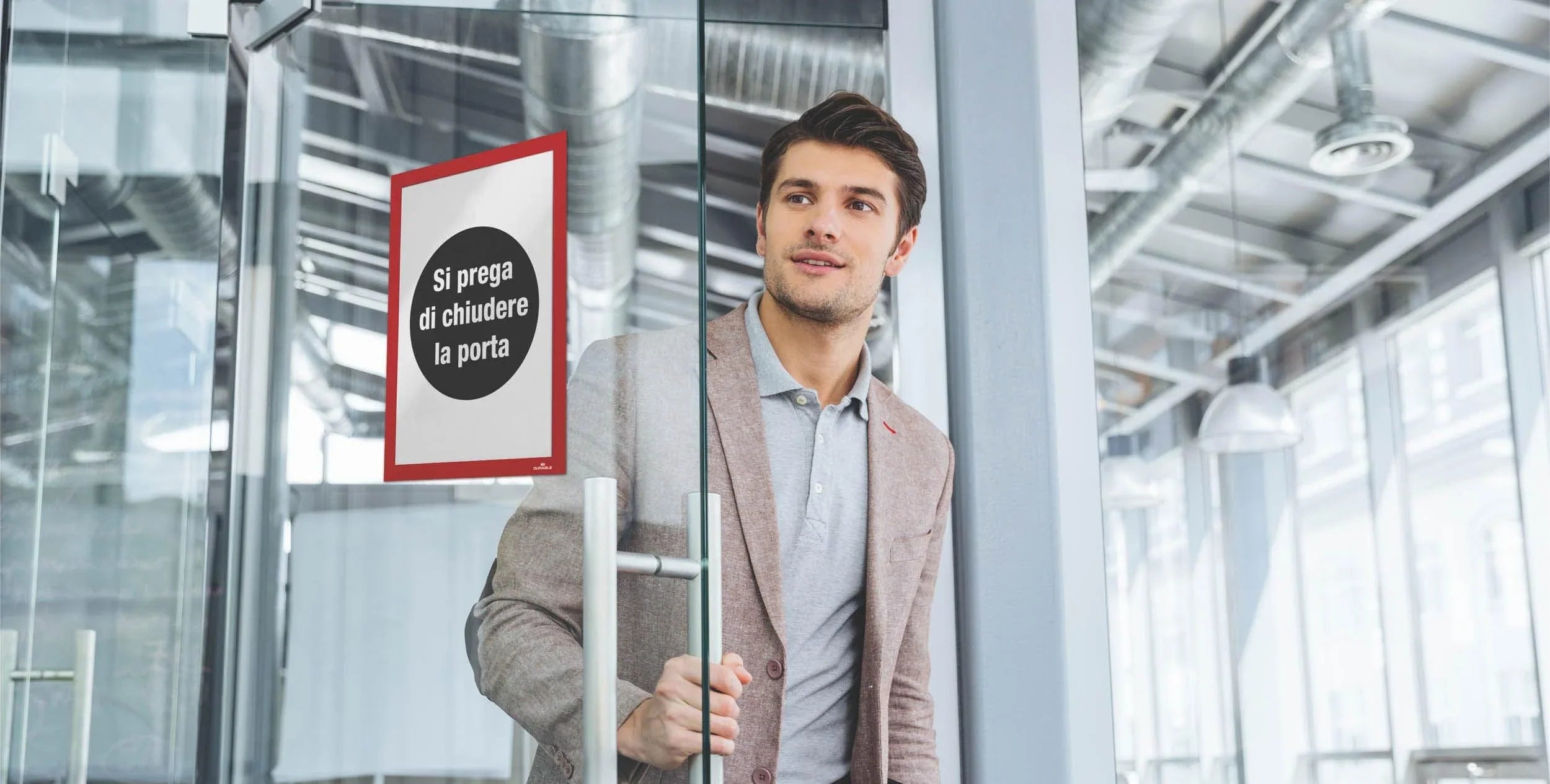 Duraframe self adhesive on a glass door showing the room name.