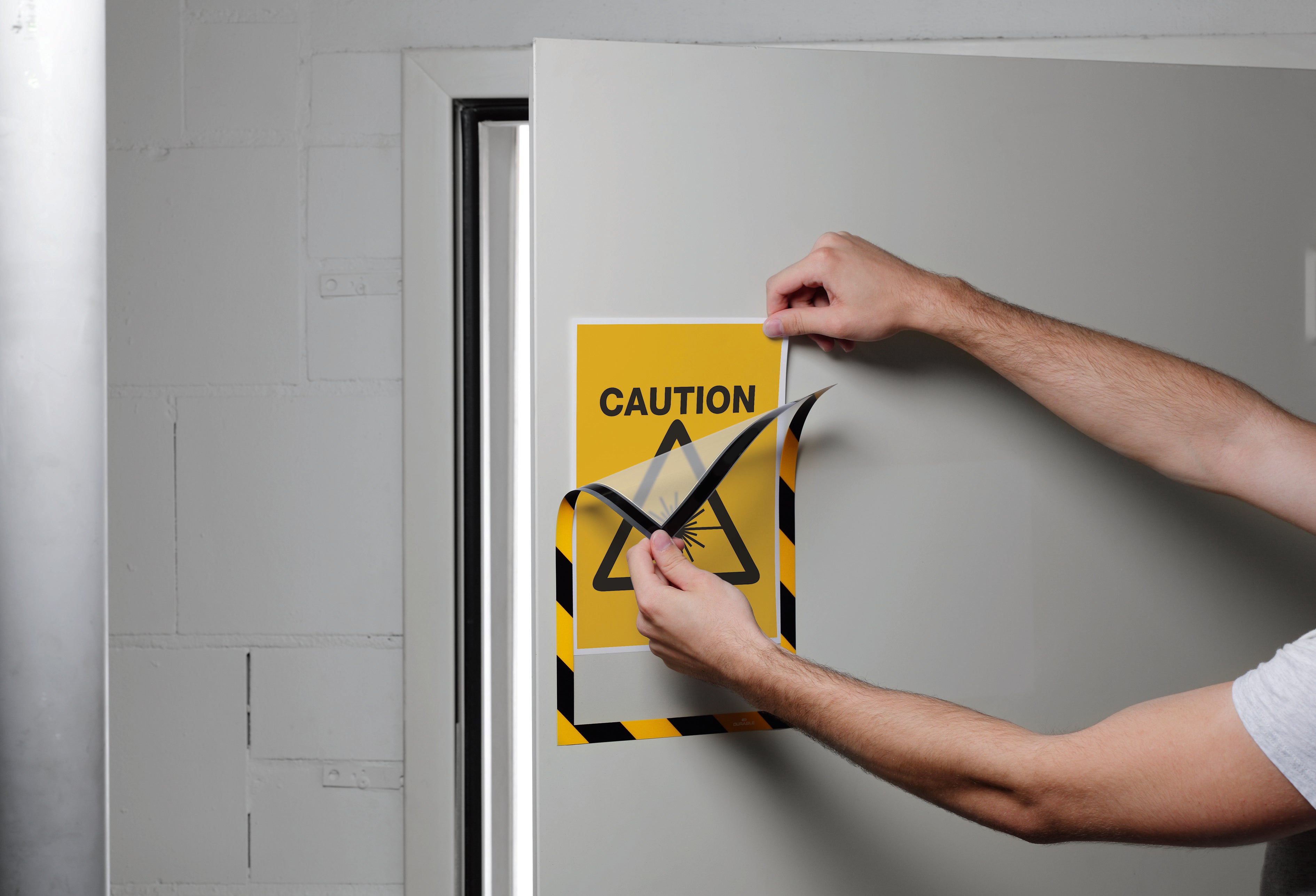 Duraframe Security Infoframe with caution sign on door