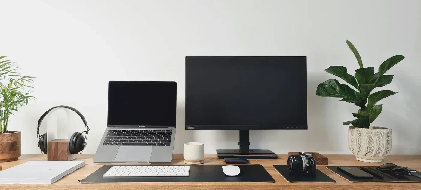 Home office setup with laptop stands and durable desk mats