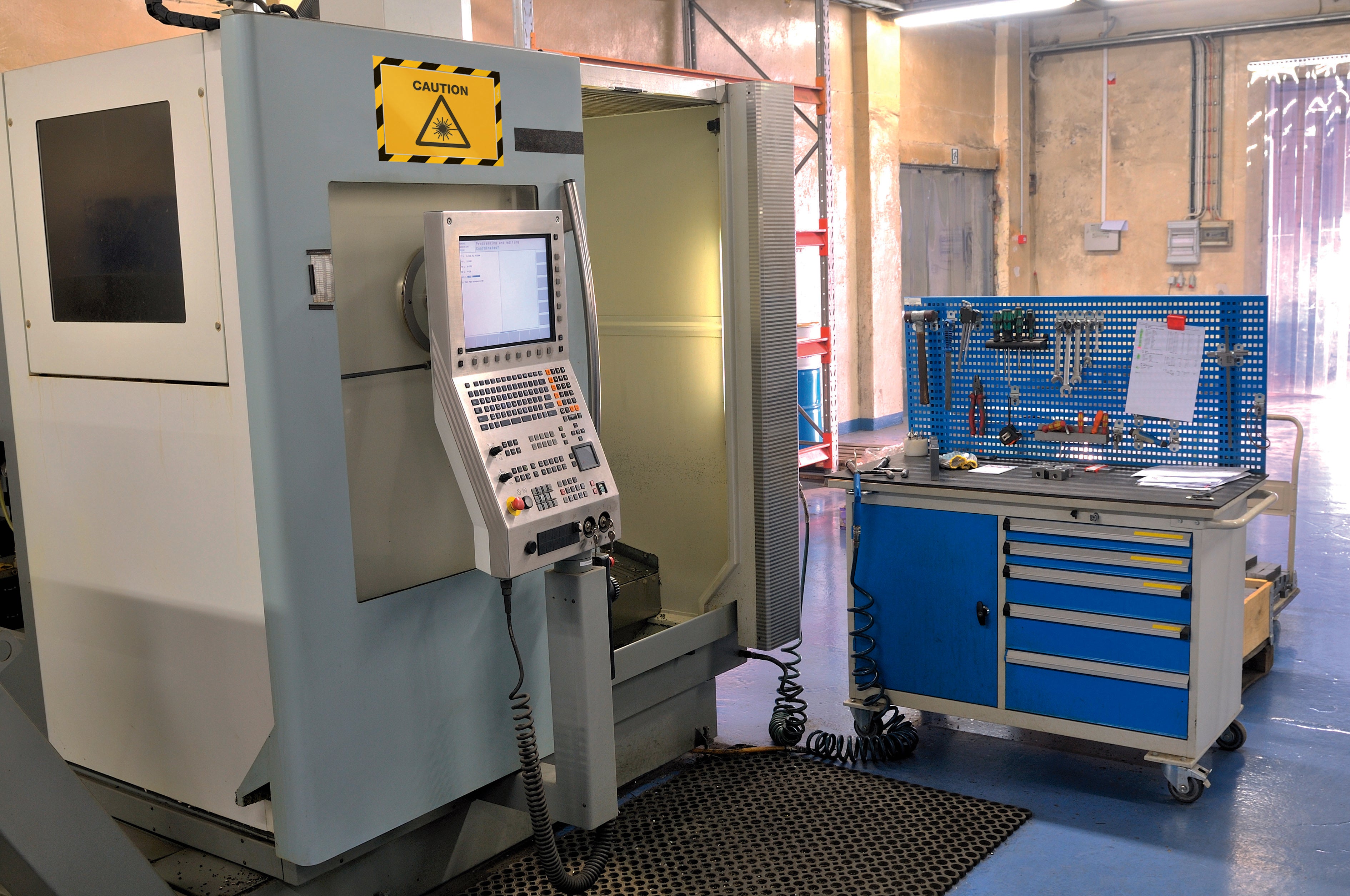 Duraframe Security Infoframe with caution sign on metal machine